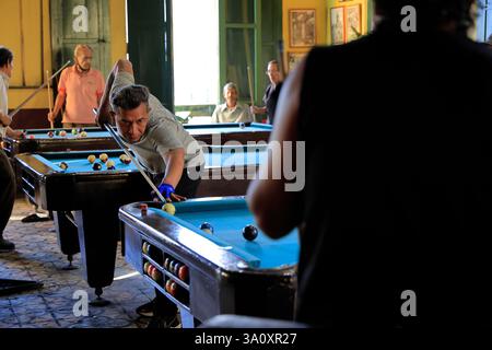 People playing billiards in Club La Dalia, a historic billiards club since 1900s located in historic center of San Salvador. El Salvador Stock Photo