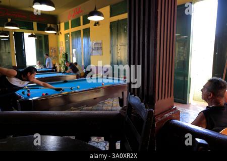 People playing billiards in Club La Dalia, a historic billiards club since 1900s located in historic center of San Salvador. El Salvador Stock Photo