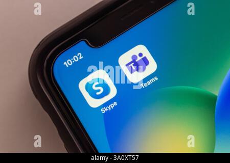 Mexico City, MEXICO - Mar 5 2025 : Skype and Microsoft Teams icons are displayed on an iPhone, symbolizing Skype’s decline as Teams takes the lead. Stock Photo