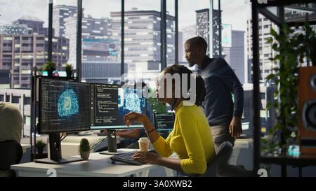 Software engineer conducts code review to fix bugs, identifying technical issues with artificial intelligence company software. African american woman debugging and optimizing code using AI, camera B Stock Photo