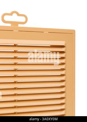 Ventilation grate isolated on a white background. Material plastic. Color orange. Close-up. Stock Photo
