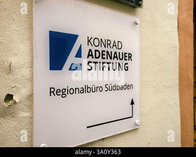 Freiburg, germany - Feb 10, 2025: Sign for the Regional Office of Konrad Adenauer Stiftung in SUdbaden, located on a textured wall in Freiburg. Stock Photo
