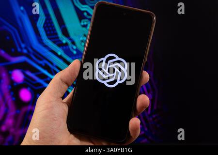 BOGOTA, COLOMBIA - MARCH 05 OF 2025 Macro photo of a smartphone with chat gpt symbol over a blurred technology concept backgroud Stock Photo