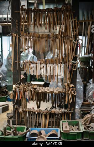 Photo shows the hammers and other tools used  to forge hibashi furin wind chimes at Myochin Furin Honpo in Himeji City, Japan. Stock Photo