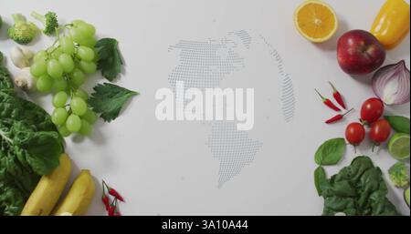 Rotating globe image over fresh fruits and vegetables on white background Stock Photo