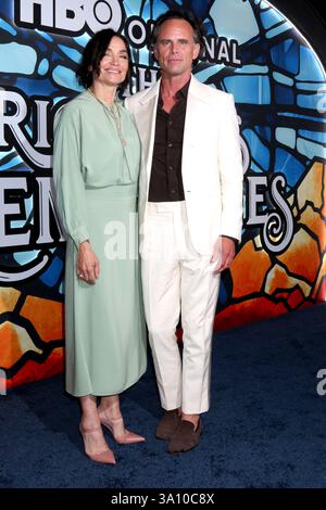 Walton Goggins, left, and Nadia Conners arrive at the 77th Emmy Awards
