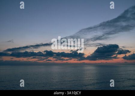 A beautiful scenery of an amazing sunset over the sea Stock Photo