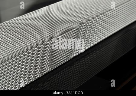 Soundbar reflected in a glossy black table. Listening to music and watching movies. Perspective view Stock Photo