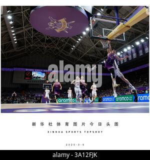 Beijing, China. 6th Mar, 2025. Liao Sanning (front) of Beijing Royal Fighters dunks during the 36th round match between Beijing Royal Fighters and Zhejiang Golden Bulls at the 2024-2025 Chinese Basketball Association (CBA) league in Beijing, China, March 6, 2025. Credit: Wang Lili/Xinhua/Alamy Live News Stock Photo