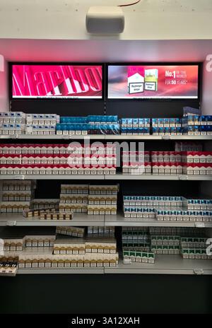 new marlboro cigarettes 2025 Keflavik, Iceland - 05. March 2025: Packs of Marlboro cigarettes are neatly  stacked on shelves in a duty-free shop, illuminated by bright Marlboro adv  Stock Photo