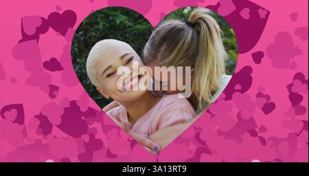 Image of pink hearts over diverse couple embracing Stock Photo