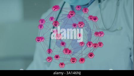 Image of globe with connections and medical icons over male doctor using tablet Stock Photo