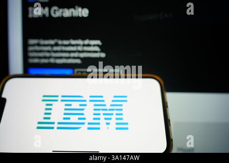 Roosendaal, The Netherlands - March 6, 2025: A mobile phone displaying the logo of IBM, with the company website in the background. Stock Photo