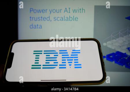 Roosendaal, The Netherlands - March 6, 2025: A mobile phone displaying the logo of IBM, with the company website in the background. Stock Photo