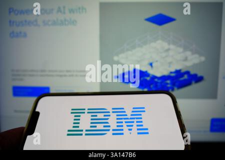 Roosendaal, The Netherlands - March 6, 2025: A mobile phone displaying the logo of IBM, with the company website in the background. Stock Photo