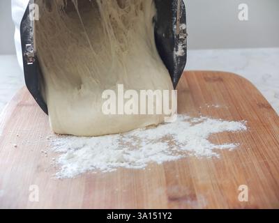 the baking dough is laid out on a board Stock Photo