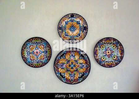 Ornamental  mexican ceramic plates isolated on a white wall Stock Photo