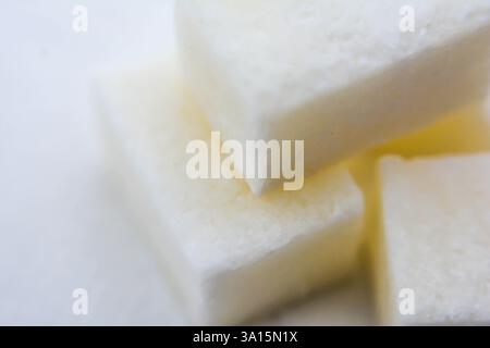 Refined sugar cubes on a white background. Close-up, macro. White sugar cubes. Stock Photo