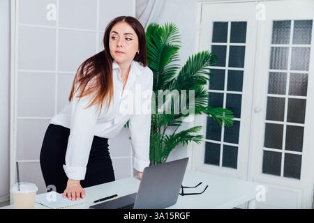 Business woman at desk, work laptop in office online Stock Photo