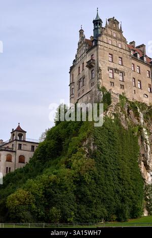 Majestic Sigmaringen Castle Perched on Rugged Cliff Above Tranquil Danube: Historic Hohenzollern Residence Showcases Medieval Architecture and Royal Stock Photo