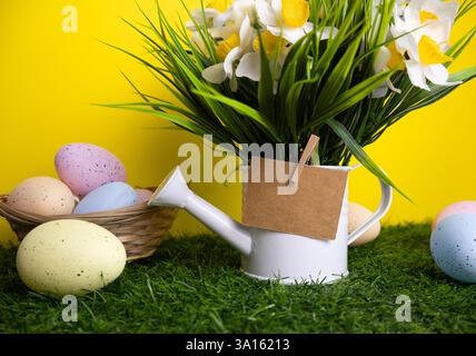 Easter background with yellow flowers colorful eggs and inscription card Happy Easter Stock Photo
