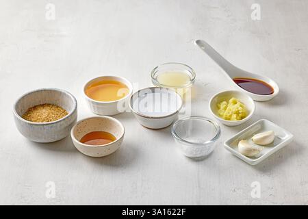 various salad dressing ingredients on white table background Stock Photo
