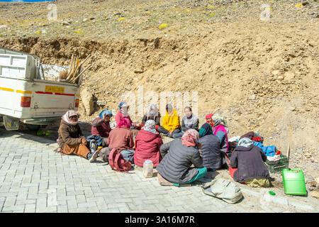 India, Ladakh state, Trans-Himalayan, motorbike tour on Royal enfield between Pangong Lake and Tso Khar Lake, road workers having lunch break Stock Photo