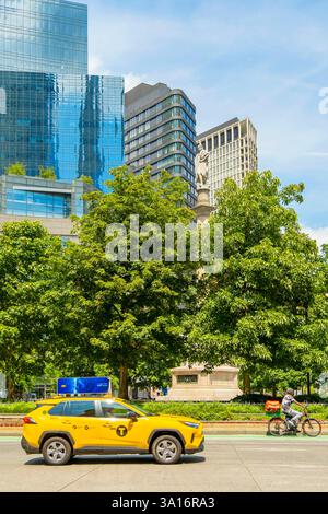 United States, New York State, New York City, Manhattan, Midtown, Columbus Circle, buildings and taxi Stock Photo