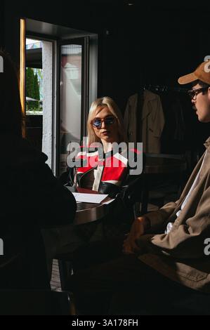people chatting in a bar Stock Photo