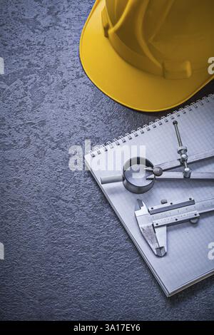 Copybook hard hat drawing compass vernier scale construction concept Stock Photo