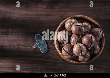 Macadamia Nuts In Wooden Bowl Key For Open On Vintage Wood Stock Photo