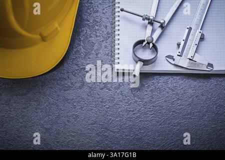 Copybook hard hat divider vernier scale construction concept Stock Photo