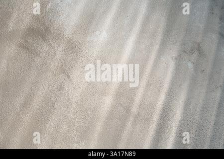 Light and shadows falling on color textured background Stock Photo