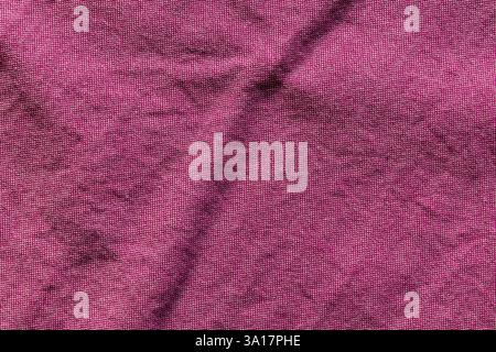 A soft pink canvas featuring very small white squares, creating a delicate and subtle pattern, perfect for backgrounds or design use Stock Photo