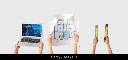 Architects with house plan, laptop and levels on light background Stock Photo