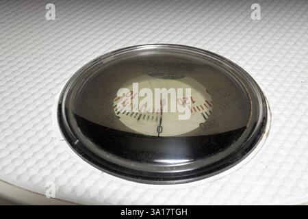rotating measuring scale of analog bathroom scales with white ribbed ...