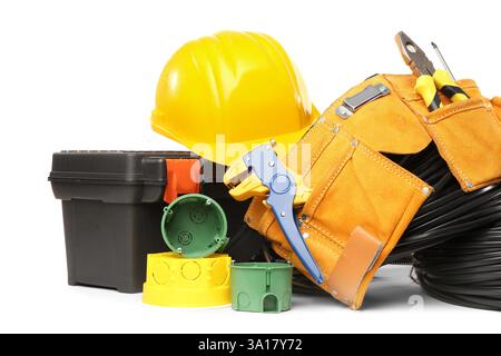 Electrician tools, rolled cables, electrical junction box and socket mounting boxes on white background Stock Photo