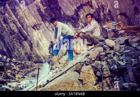 Malaysia, men drilling in a tin mine Stock Photo