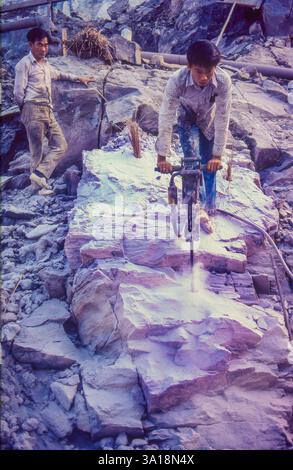 Malaysia, men drilling in a tin mine Stock Photo