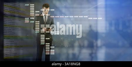 Background from night glowing building. A man in a business suit stands tall. He uses a mobile phone. Work schedule reports and estimates. Stock Photo