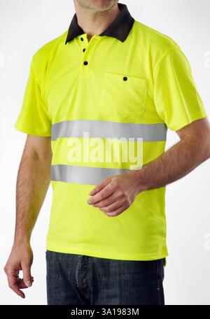 man wearing a neon yellow safety shirt in studio Stock Photo
