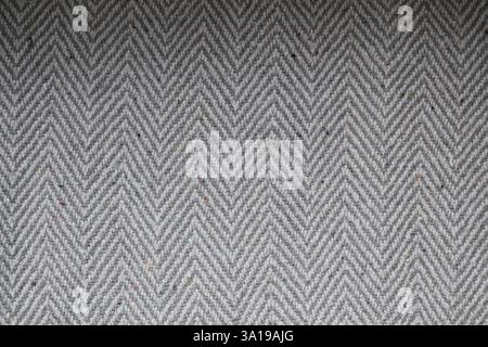 A close up of a gray and white checkered pattern. The checkered pattern is made up of many small squares, and the squares are all different sizes Stock Photo