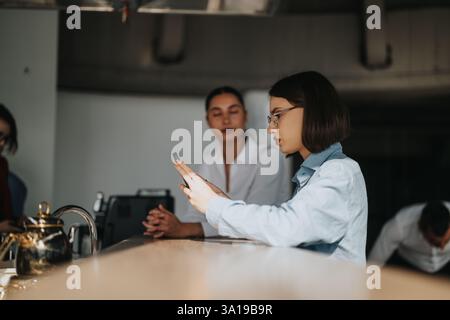 Multicultural business workers enjoying a break at the office Stock Photo