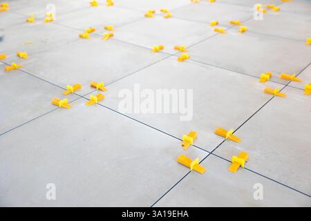 Tile leveling system ensuring perfect tile alignment during installation Stock Photo