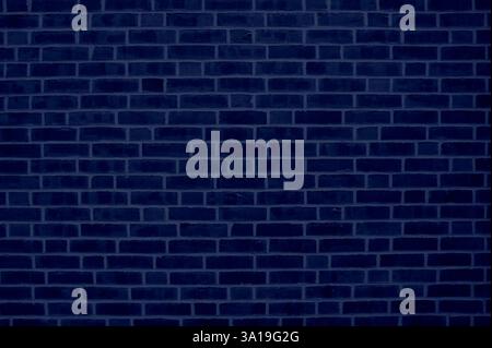 Cool background of a brick wall with dark blue stones Stock Photo