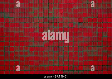 Decorative background backdrop with red-grey stone tiles with weathered color Stock Photo