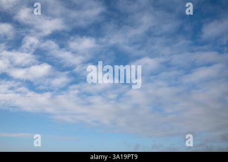View to sky with fleecy clouds Stock Photo