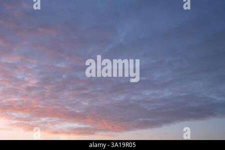 Evening sky with pastel-colored clouds Stock Photo
