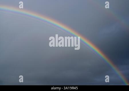Low angle view to sky with rainbow Stock Photo