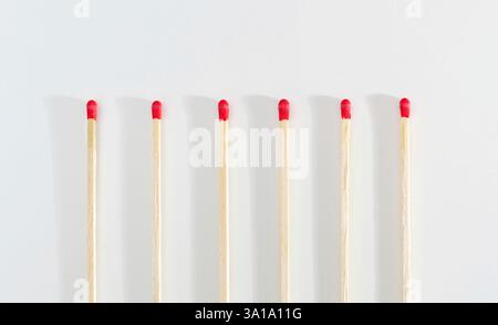 Many matches sticks for lighting a fire on white background. Stock Photo